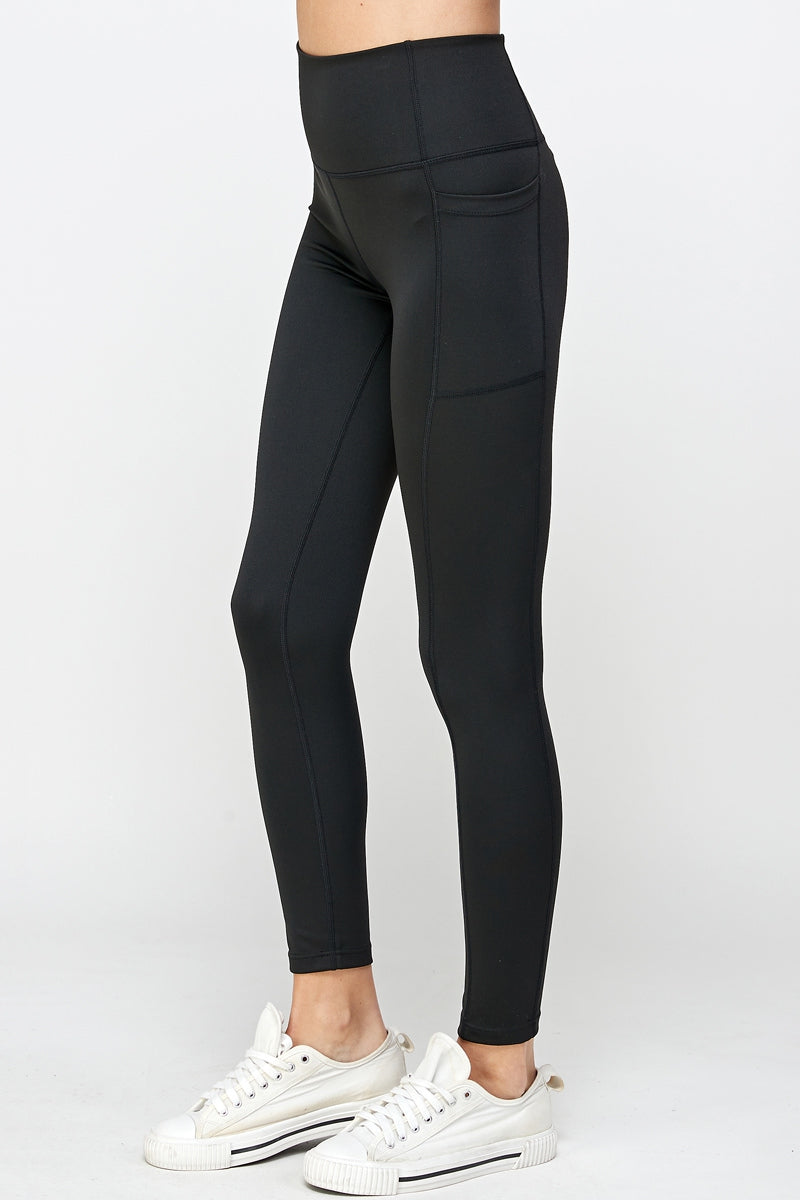 Black stretch leggings with side pockets