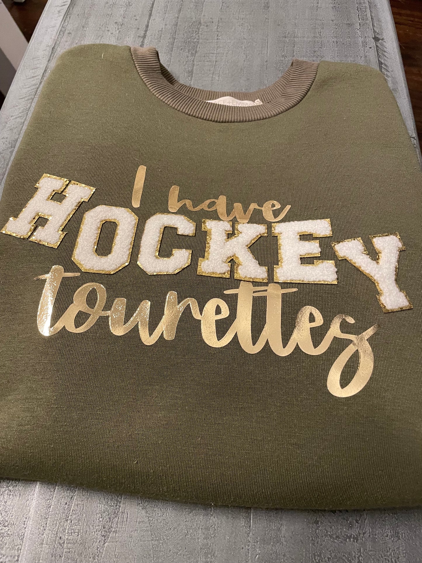 I have HOCKEY Tourettes Sweatshirt